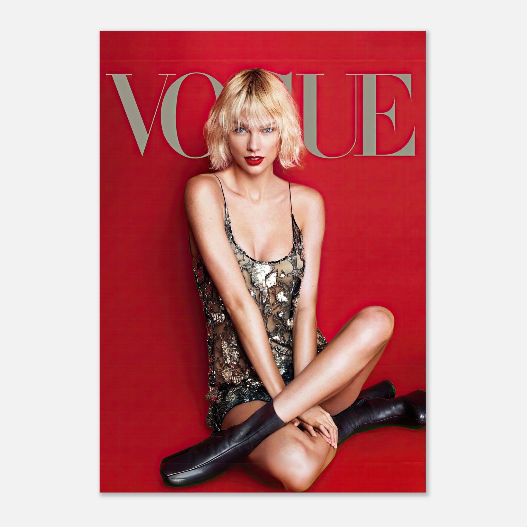 Taylor Swift Vogue poster featuring her in a stunning outfit against a vibrant red background. Perfect for fans and decor.