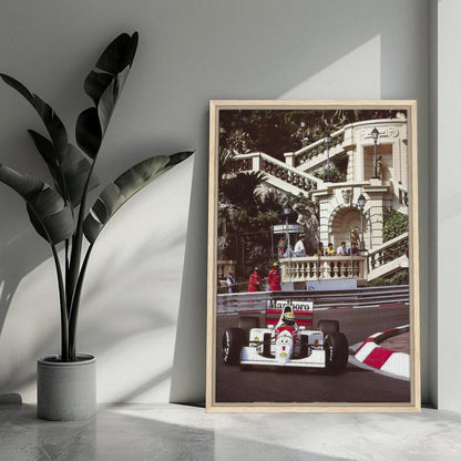 Framed canvas print of Ayrton Senna racing in Monaco, capturing vibrant colors and detailed artistry for motorsport enthusiasts.