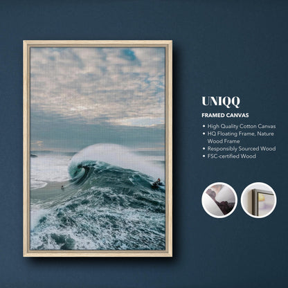 Big Wave Surfing Framed Canvas Print showcasing a surfer riding a massive wave with a natural wood frame.