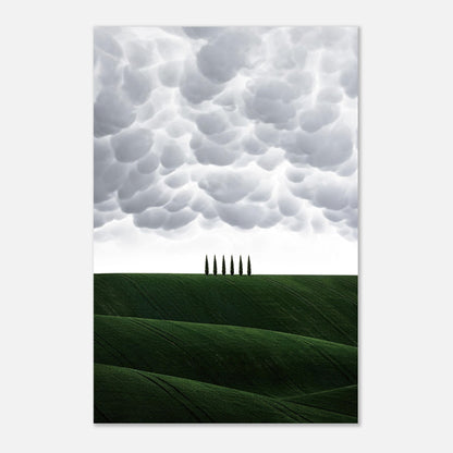 Toscanan landscape metal print featuring rolling green hills and cypress trees under dramatic clouds.