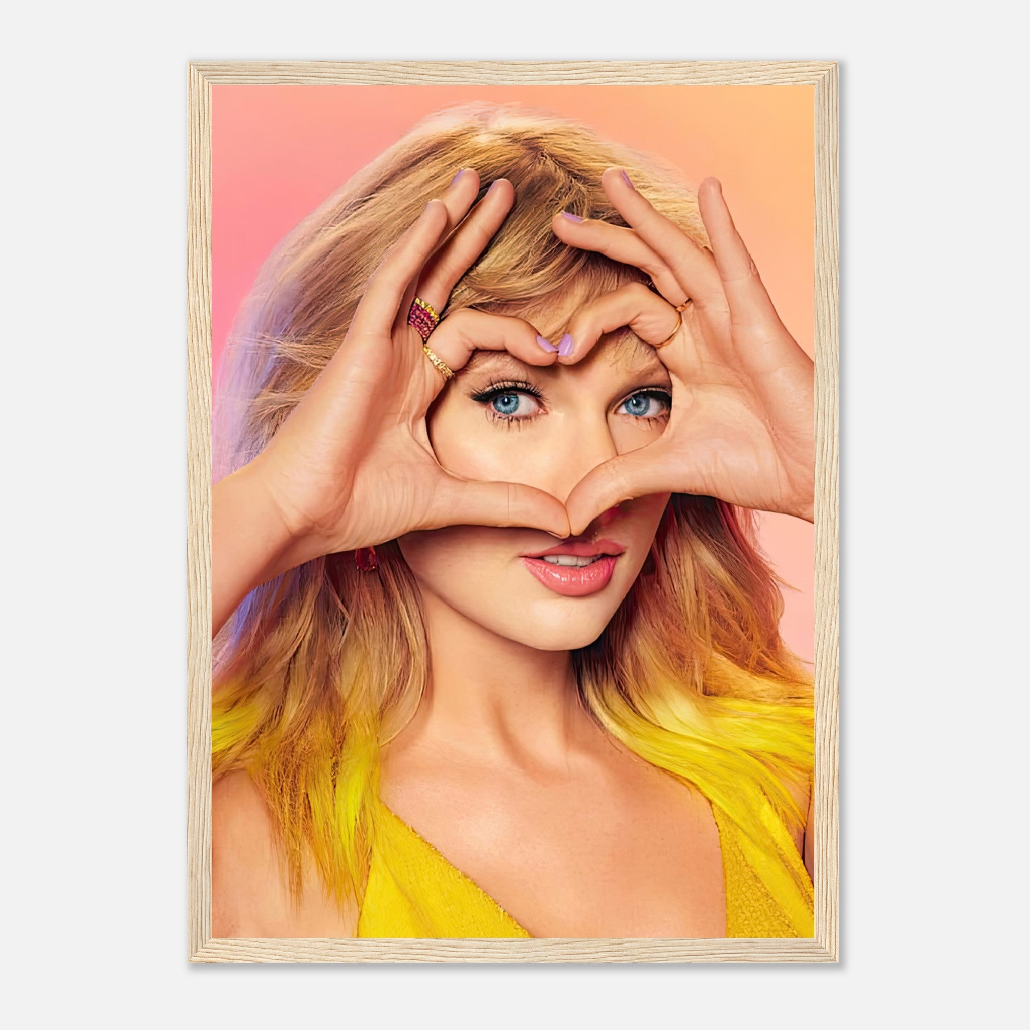 Taylor Swift framed print showing her making a heart shape with hands, celebrating music and style in vibrant colors.