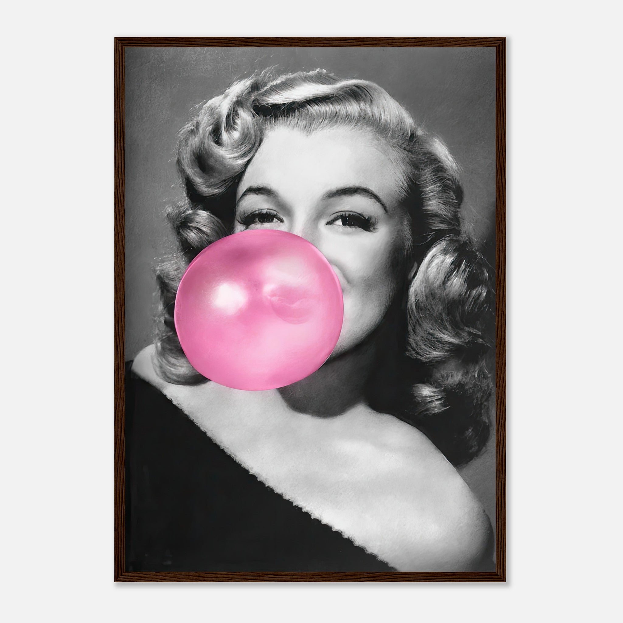 Framed print of Marilyn Monroe blowing pink bubble gum, adding a quirky touch to wall décor with a vintage Hollywood vibe.