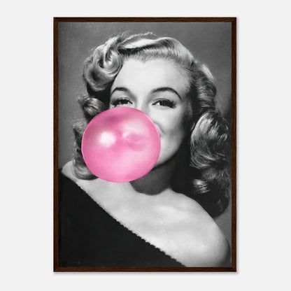 Framed print of Marilyn Monroe blowing pink bubble gum, adding a quirky touch to wall décor with a vintage Hollywood vibe.