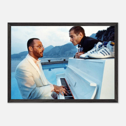 Jean Reno playing piano poolside, with a stunning coastal backdrop, from the iconic film *The Big Blue*. Fine art print.