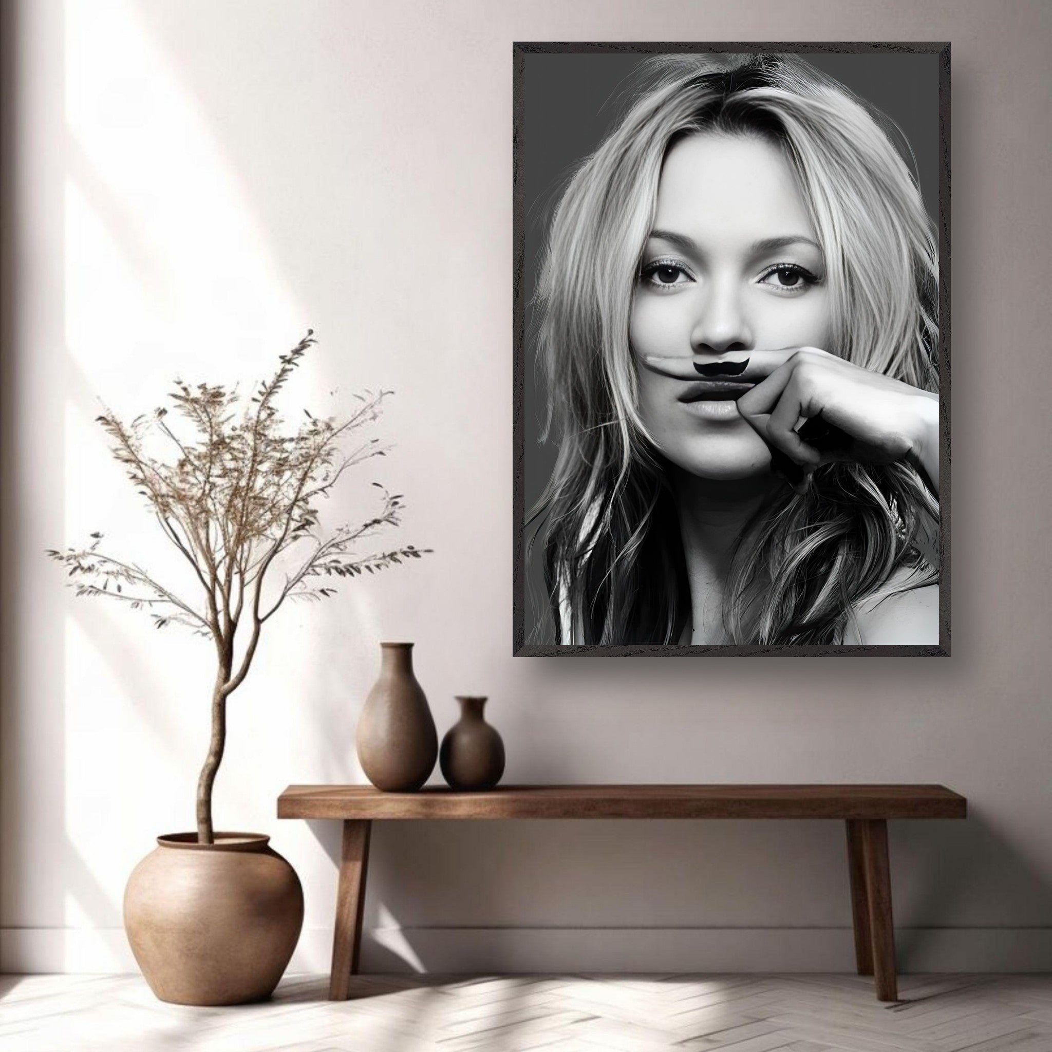 Vintage framed print featuring a black-and-white portrait of a woman with a playful mustache in a stylish interior setting.