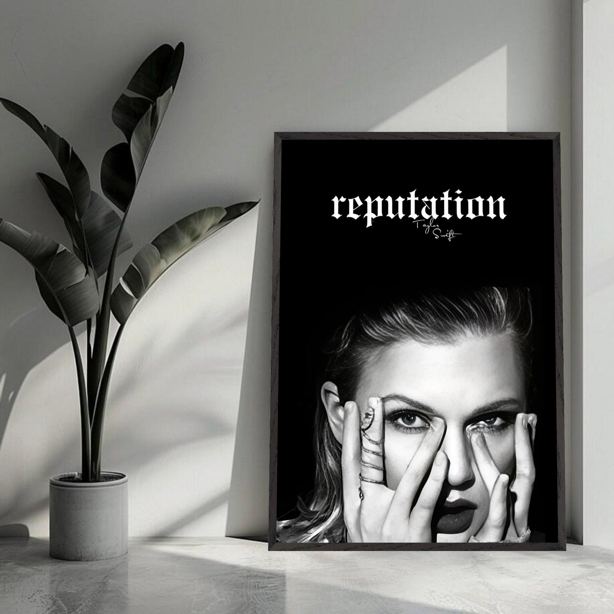 Taylor Swift Reputation vintage framed print in monochrome, featuring her portrait and bold text. Perfect for fans.