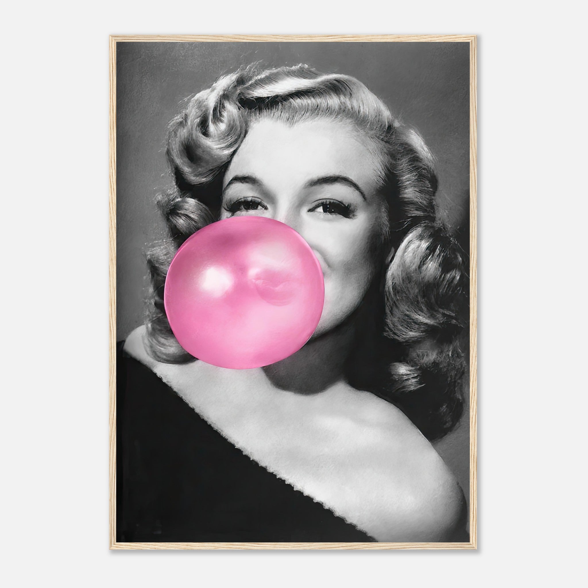 Marilyn Monroe framed print blowing pink bubble gum, adding quirky glamour to your wall décor.