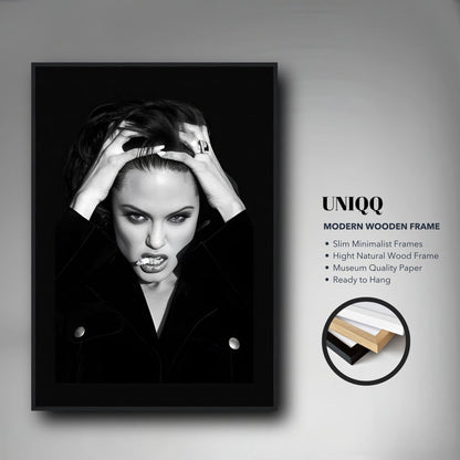 Angelina Jolie smoking framed print, showcasing dramatic black-and-white photography in a modern wooden frame.