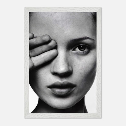 Kate Moss black and white photography framed print showcasing a close-up of her face with a hand covering one eye.