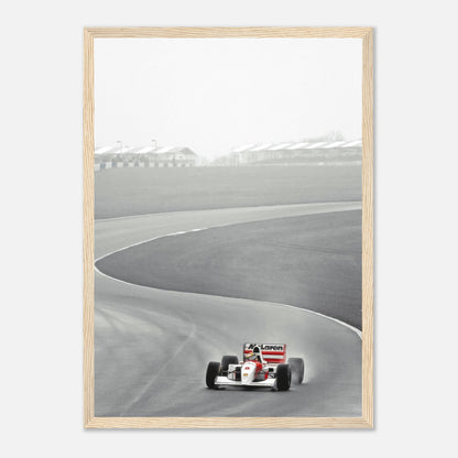 Ayrton Senna racing in the McLaren MP4/4, framed black and white print capturing motorsport history.