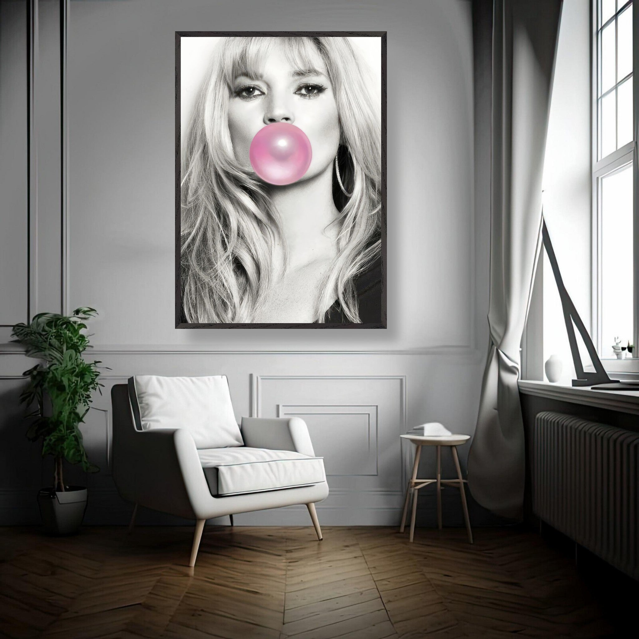 Vintage framed print of a black-and-white portrait of a woman with pink bubble gum, stylishly displayed in a modern interior.