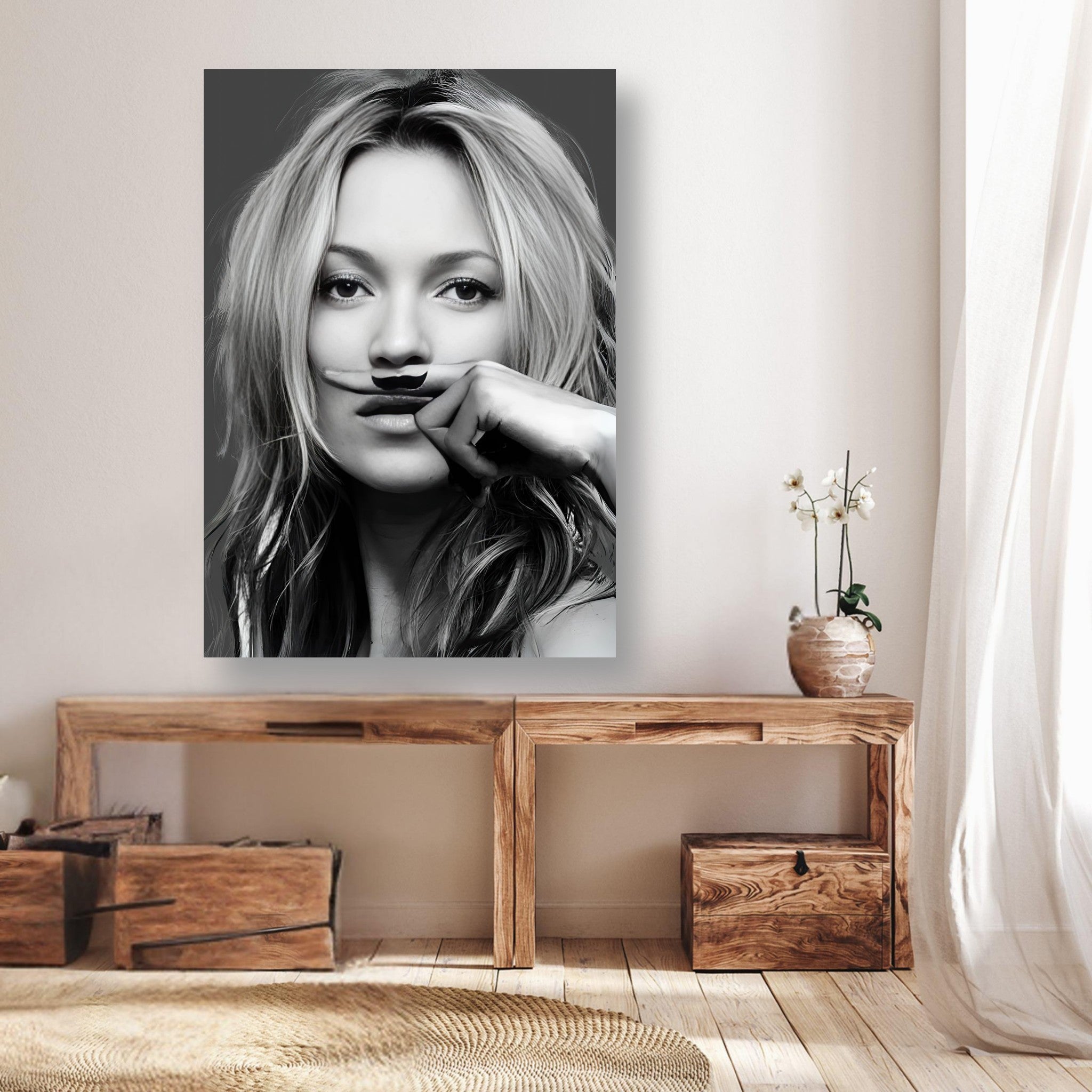 Black and white Kate Moss Mustache poster on a wall, adding playful elegance to a modern interior decor setting.