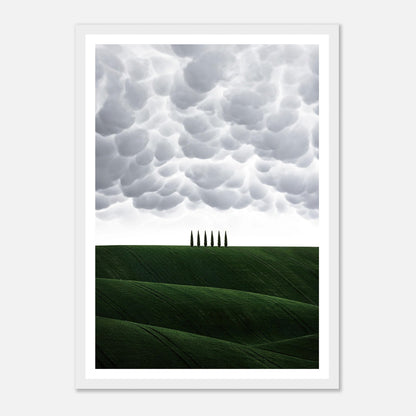 Toscana framed print showcasing green hills and cypress trees under dramatic cloud formations in Italy.