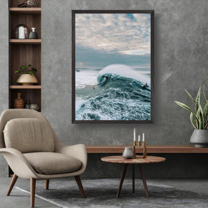 Big wave surfing fine art print displayed in a modern living room setting.