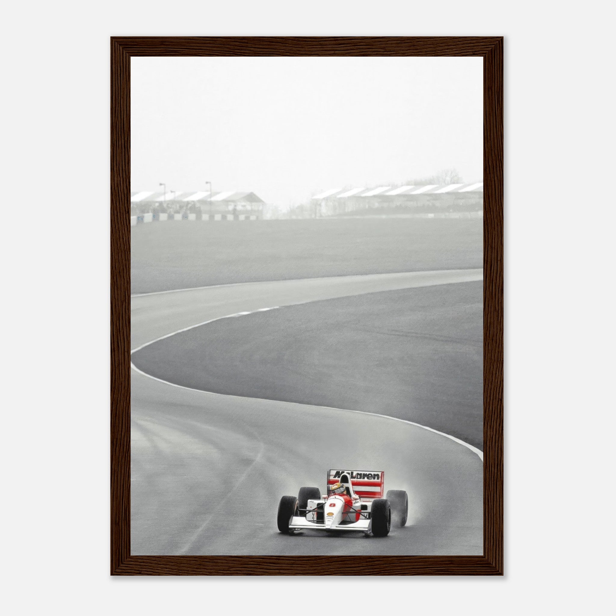 Framed print of Ayrton Senna driving the McLaren MP4/4 during the 1988 Formula 1 season on a racetrack.