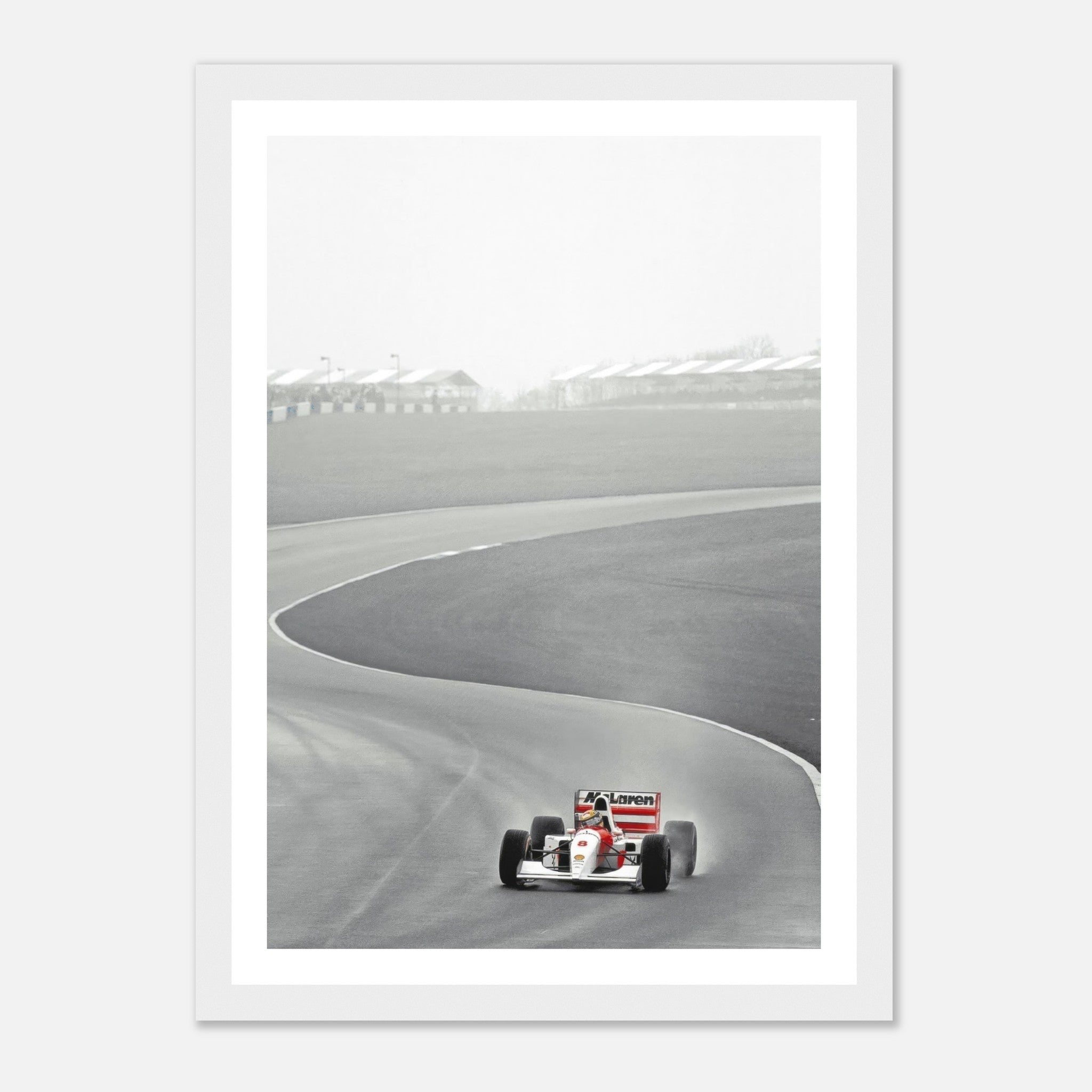 Ayrton Senna driving the McLaren MP4/4 in 1988, framed black and white photography capturing racing history.