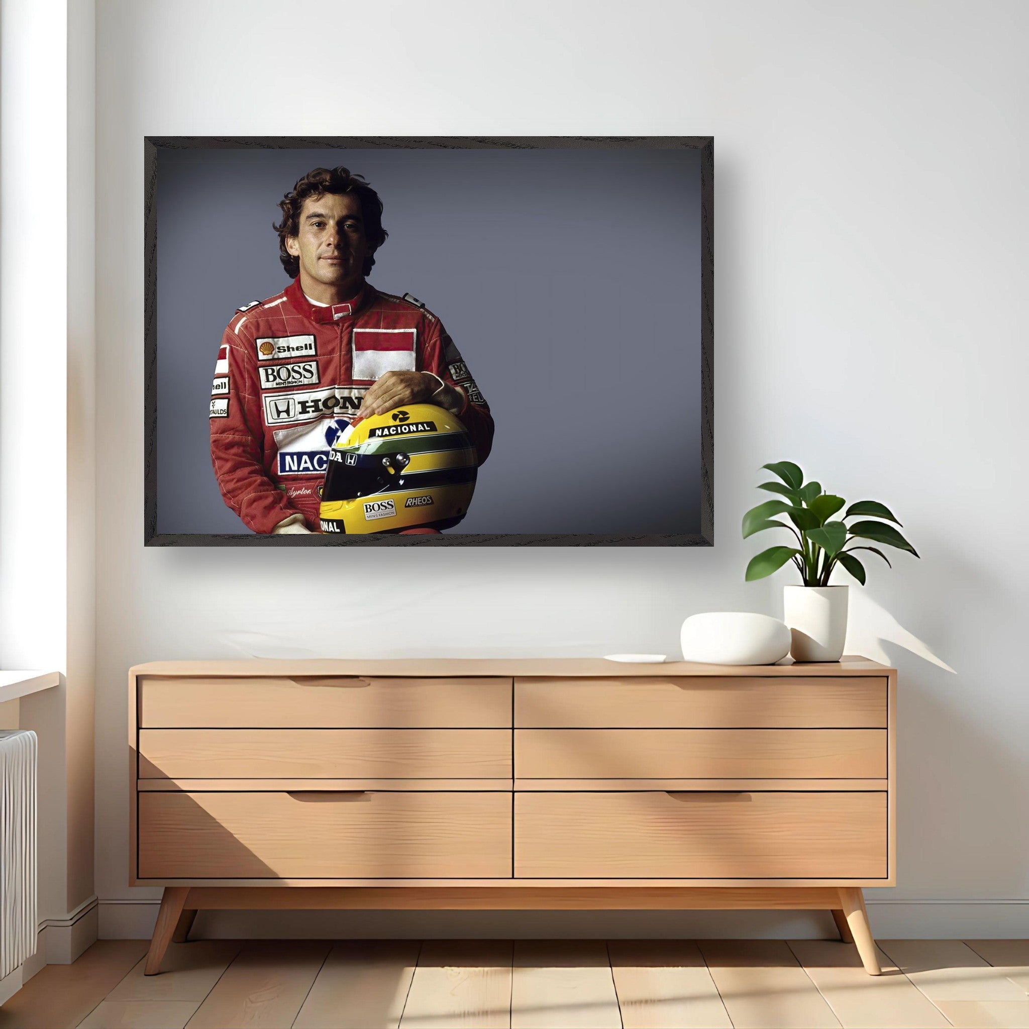 Ayrton Senna photography in a modern framed art piece displayed above a wooden cabinet.