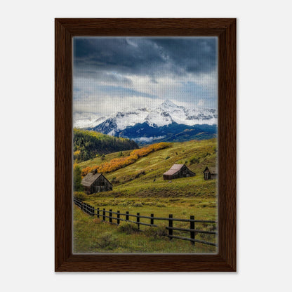 Framed canvas print of Telluride, Colorado, showcasing snow-capped mountains and rustic barns in vibrant autumn colors.