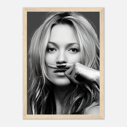 Kate Moss Mustache Framed Print featuring a black-and-white portrait with playful mustache design, perfect for modern decor.