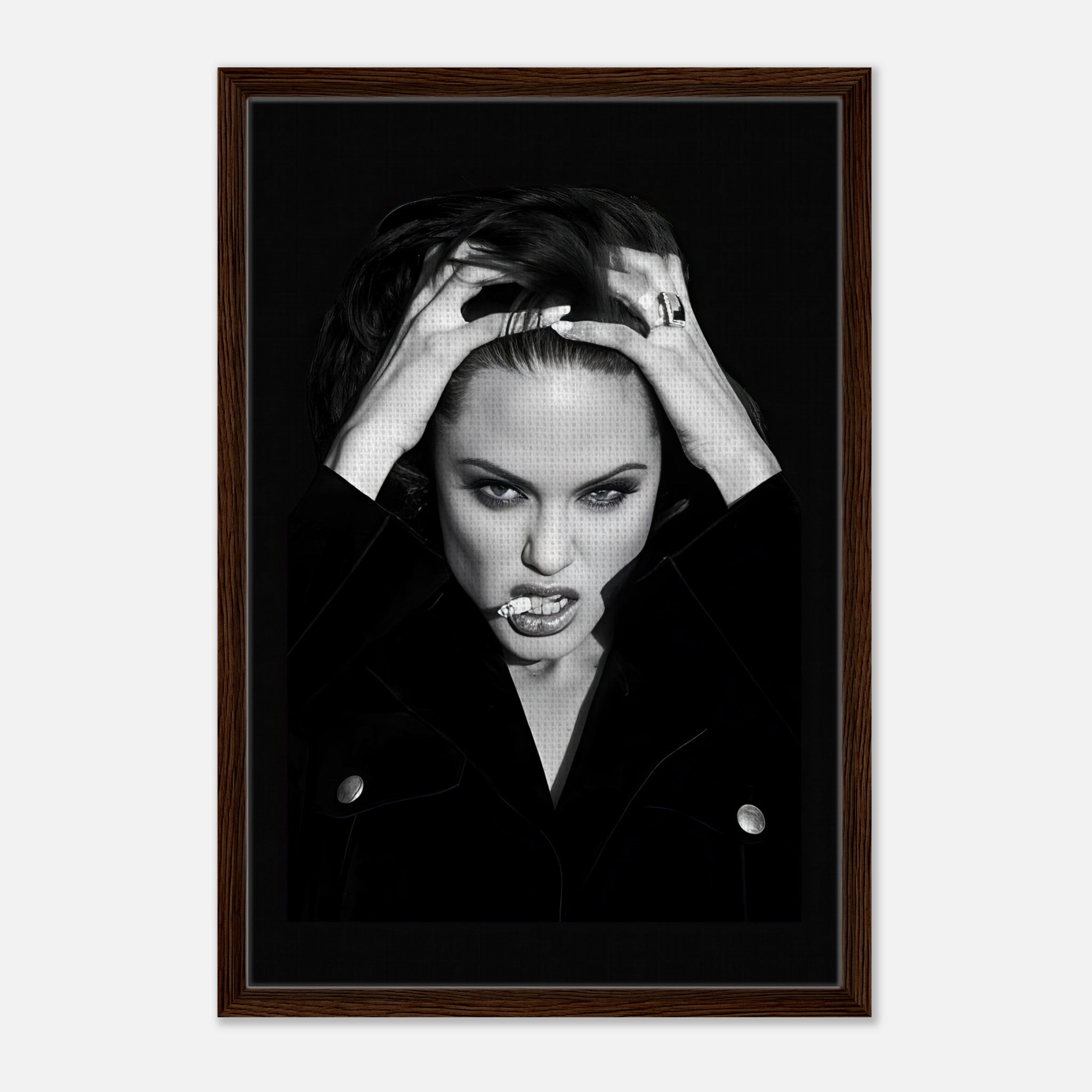 Framed canvas print of Angelina Jolie exuding elegance and rebellion with bold expression, perfect for home decor.