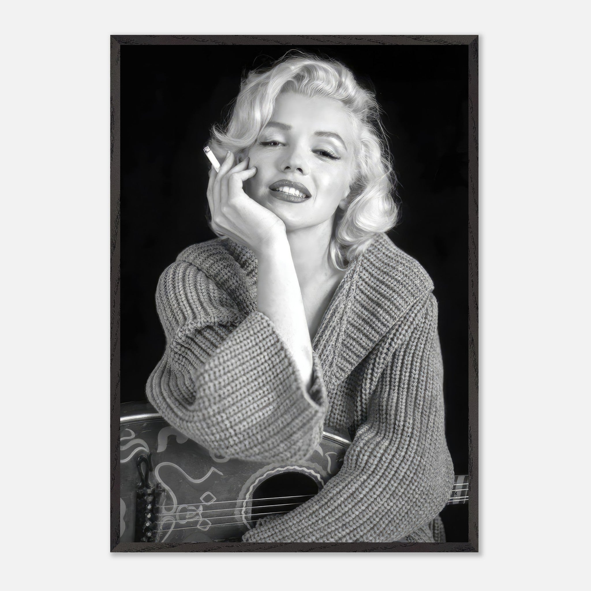 Vintage framed print of Marilyn Monroe smoking, showcasing her elegance and charm in classic black-and-white photography.