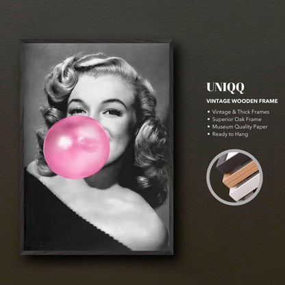 Marilyn Monroe vintage print with pink bubble gum in wooden frame, stylish wall art for home decor.