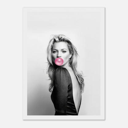 Black-and-white portrait of Kate Moss blowing bubblegum, framed print with stylish pink accent. Perfect for modern decor.