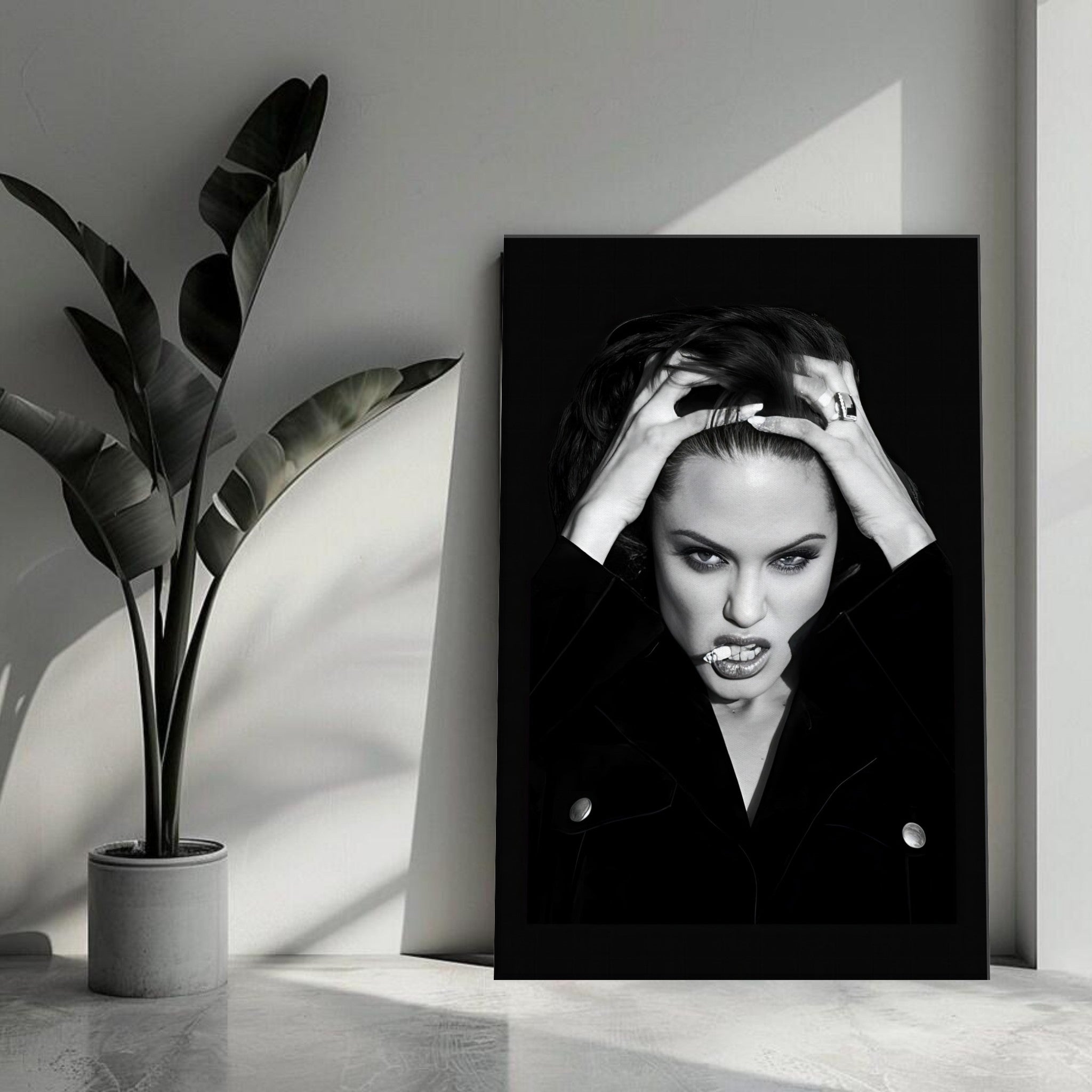 Black-and-white canvas of Angelina Jolie with a fierce expression, enhancing modern interior decor.