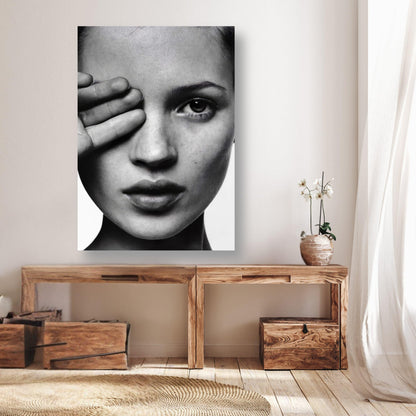 Kate Moss black and white photography poster on a wall, highlighting elegance and beauty in a modern decor setting.