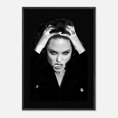 Vintage framed print of Angelina Jolie expressing raw charisma in a striking black-and-white photograph.