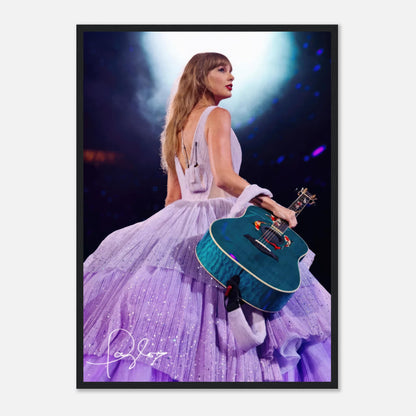 Taylor Swift framed poster featuring her in a lavender gown holding a guitar under a spotlight, perfect for fans.