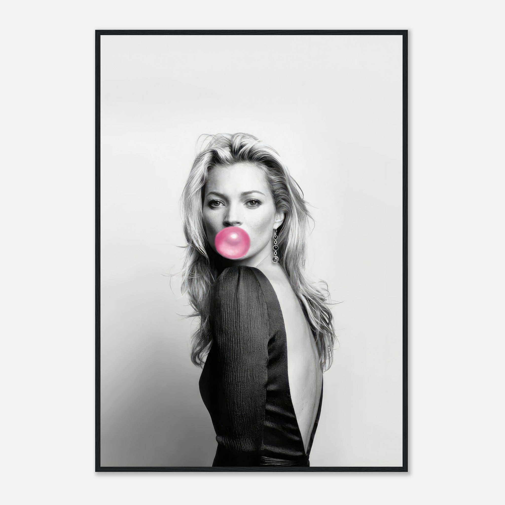 Black-and-white portrait of Kate Moss blowing bubble gum with a pink accent in a stylish framed print.