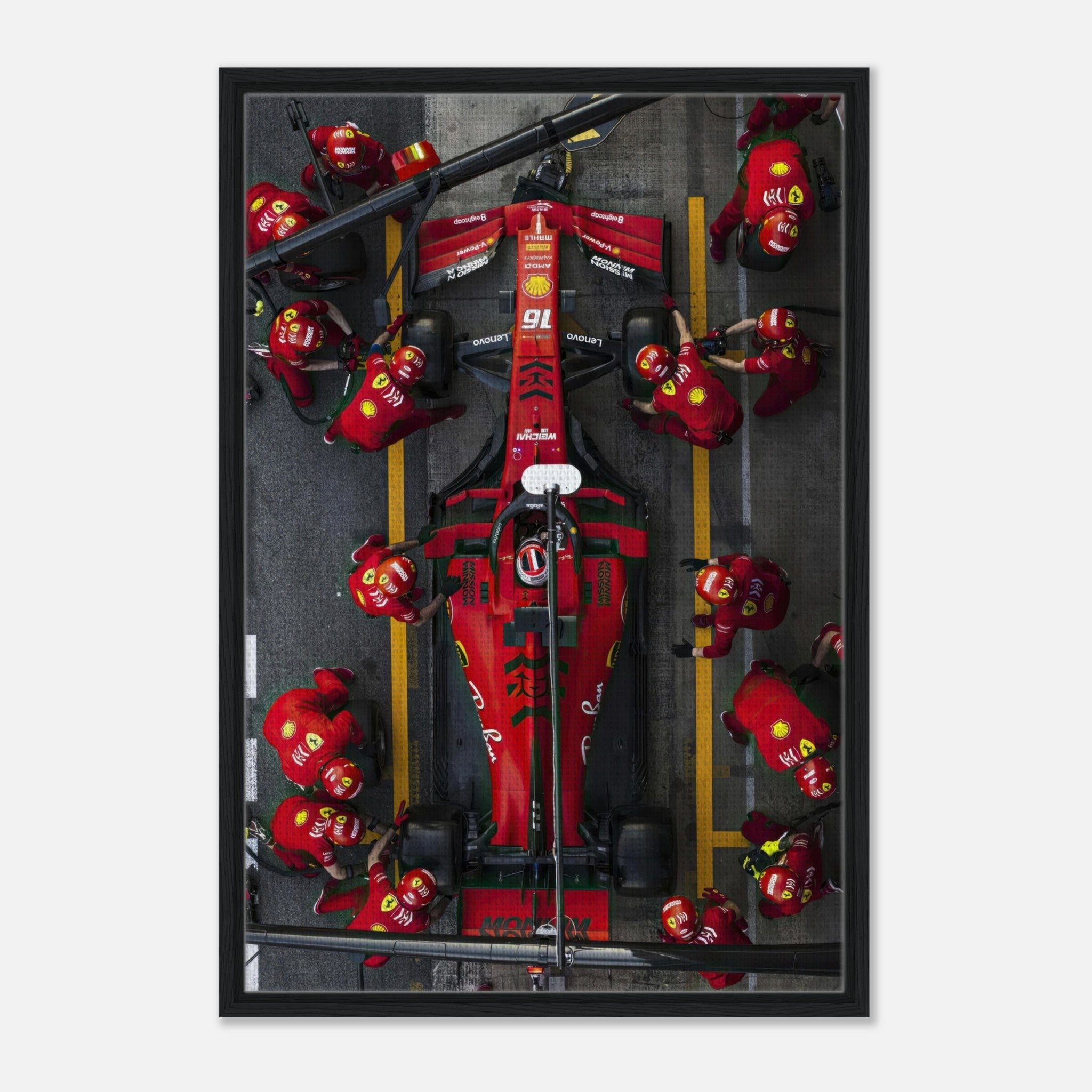 Ferrari Formula 1 pitstop framed canvas print featuring team members in action during a thrilling race moment.