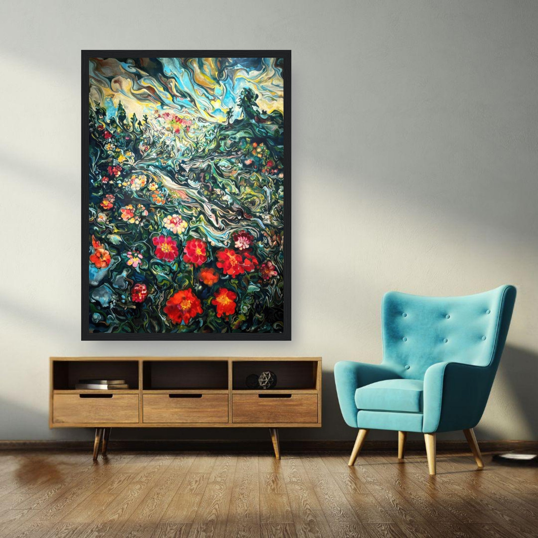 Abstract floral landscape painting framed print displayed above a modern wooden cabinet and blue armchair in a bright room.