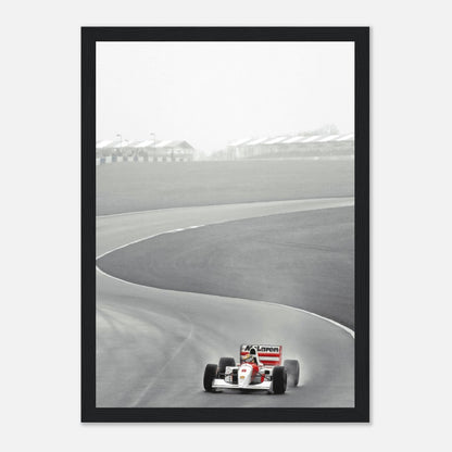 1988 Ayrton Senna driving McLaren MP4/4 on track in black and white framed print, capturing racing history.