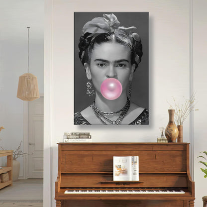 Frida Kahlo Bubble Gum canvas art featuring a grayscale portrait with vibrant pink bubble gum, displayed in a modern room.