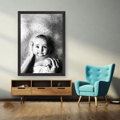 Vintage framed print of a baby in a bath surrounded by bubbles, enhancing a nostalgic atmosphere in a stylish room.