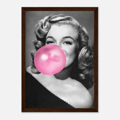 Marilyn Monroe framed print blowing pink bubble gum, adding a quirky yet classy touch to any wall decor.