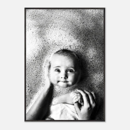Black-and-white fine art print of a baby in a bath surrounded by bubbles, capturing innocence and joy.