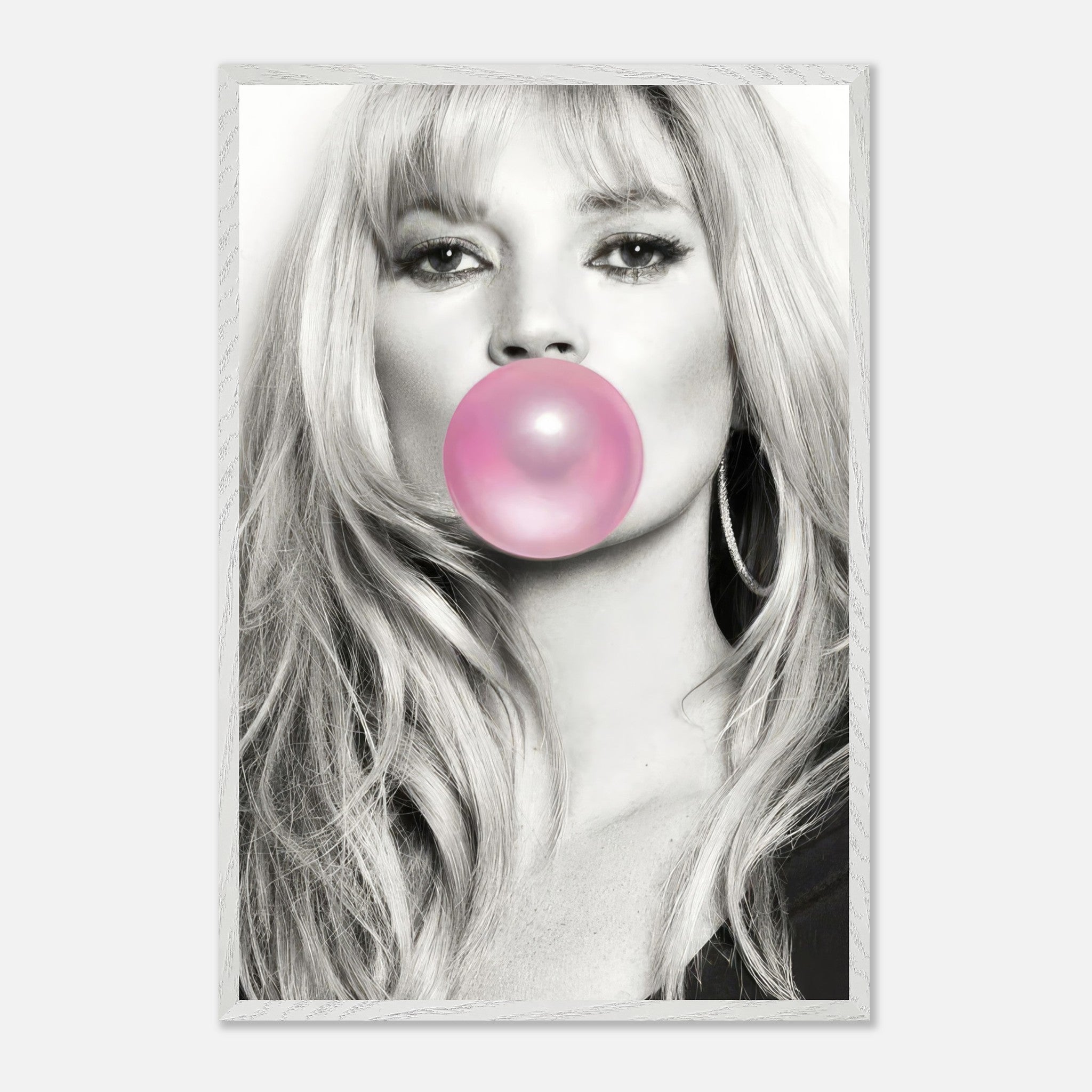 Vintage framed print of Kate Moss blowing pink bubble gum, combining black-and-white portraiture with a playful pop of color.