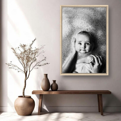 Framed Baby Bath Photography print showcasing a smiling baby in bubbles, adding warmth to any home decor.