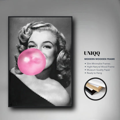 Marilyn Monroe framed print with pink bubble gum, showcasing a cheeky and glamorous wall decor piece.