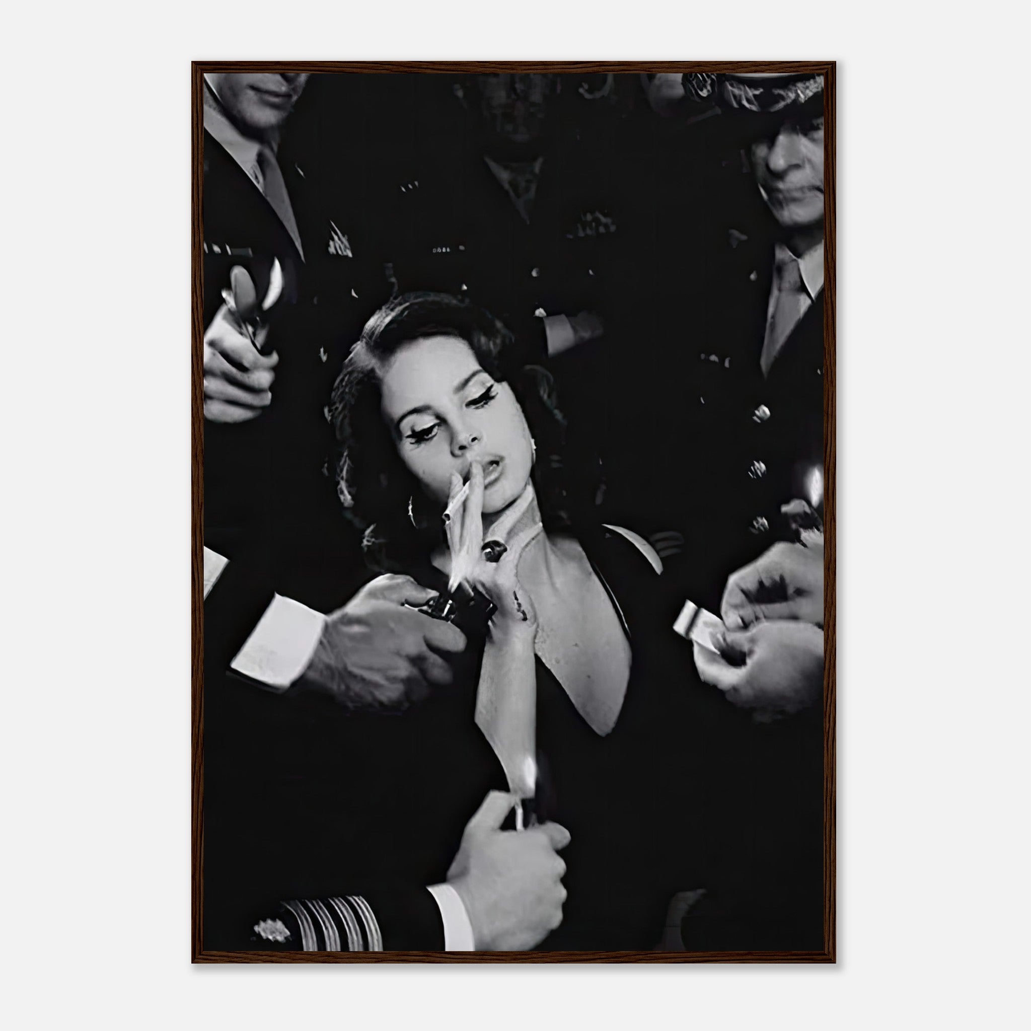 Black-and-white framed print of a woman smoking with admirers, embodying vintage Hollywood charm.