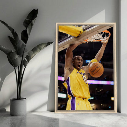 Kobe Bryant's iconic slam dunk captured in a framed canvas print showcasing his dynamism and basketball greatness.