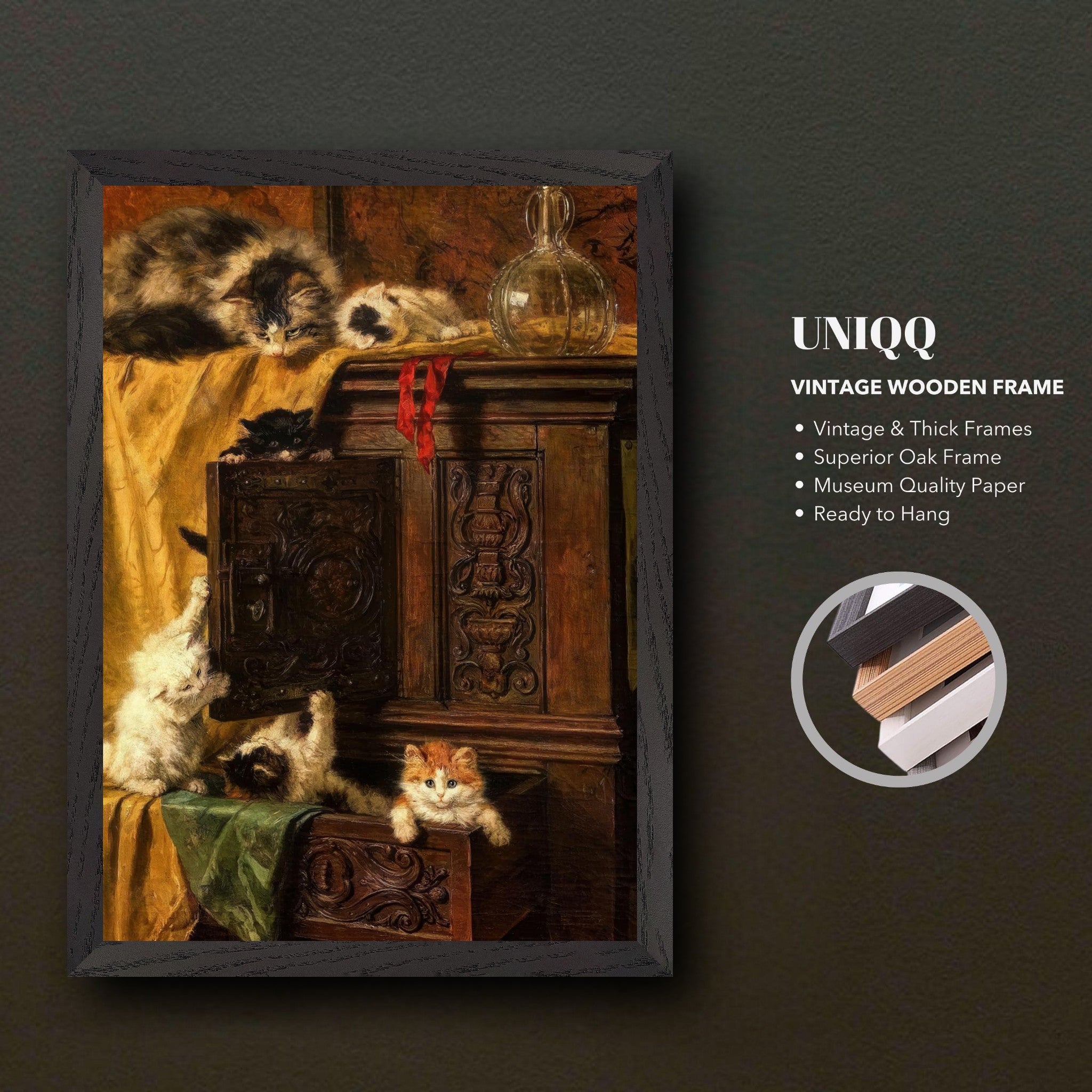 Vintage cat painting in a wooden frame featuring playful kittens on an ornate cabinet, capturing timeless charm.