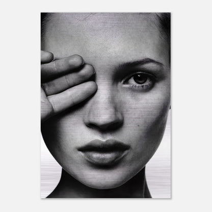 Black and white portrait of Kate Moss with hand covering eye, printed on brushed metal for a modern aesthetic.