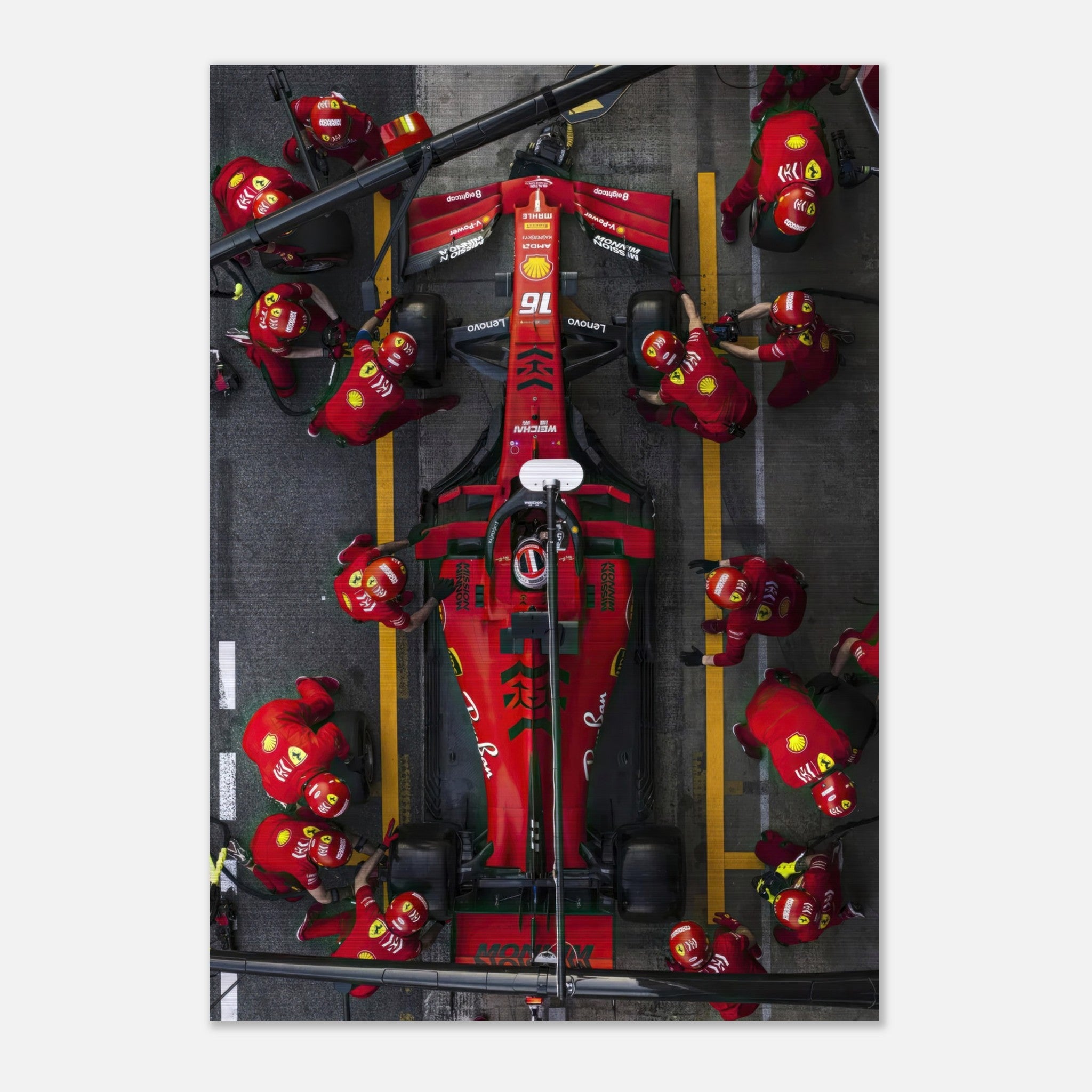 Brushed metal print of a Ferrari pitstop in Formula 1, showcasing vivid colors and intense racing action.