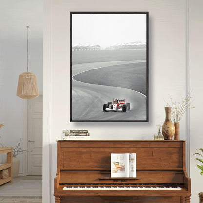 Vintage framed art of Ayrton Senna's 1988 McLaren MP4/4 racing on a track, showcased in a stylish interior setting.