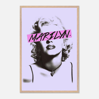 Vintage framed print of Marilyn Monroe with bold pink graphic detail on a lavender background.