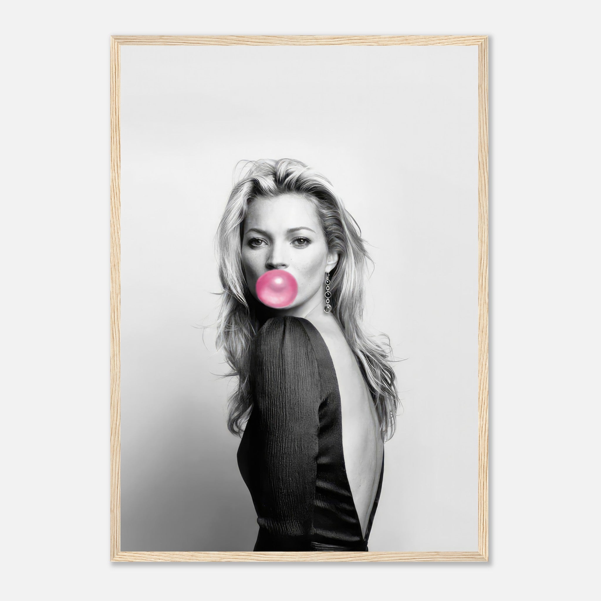 Black-and-white portrait of a woman with bubblegum, framed in a modern style, adding elegance and playfulness to decor.